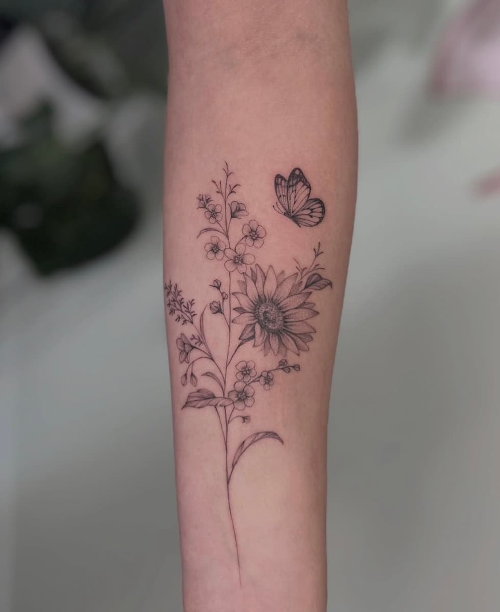 Large fine line snake and floral tattoo on the hip and upper thigh