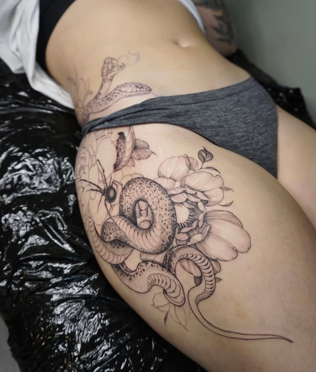 Fine line floral bouquet tattoo with sunflower and butterfly on the forearm